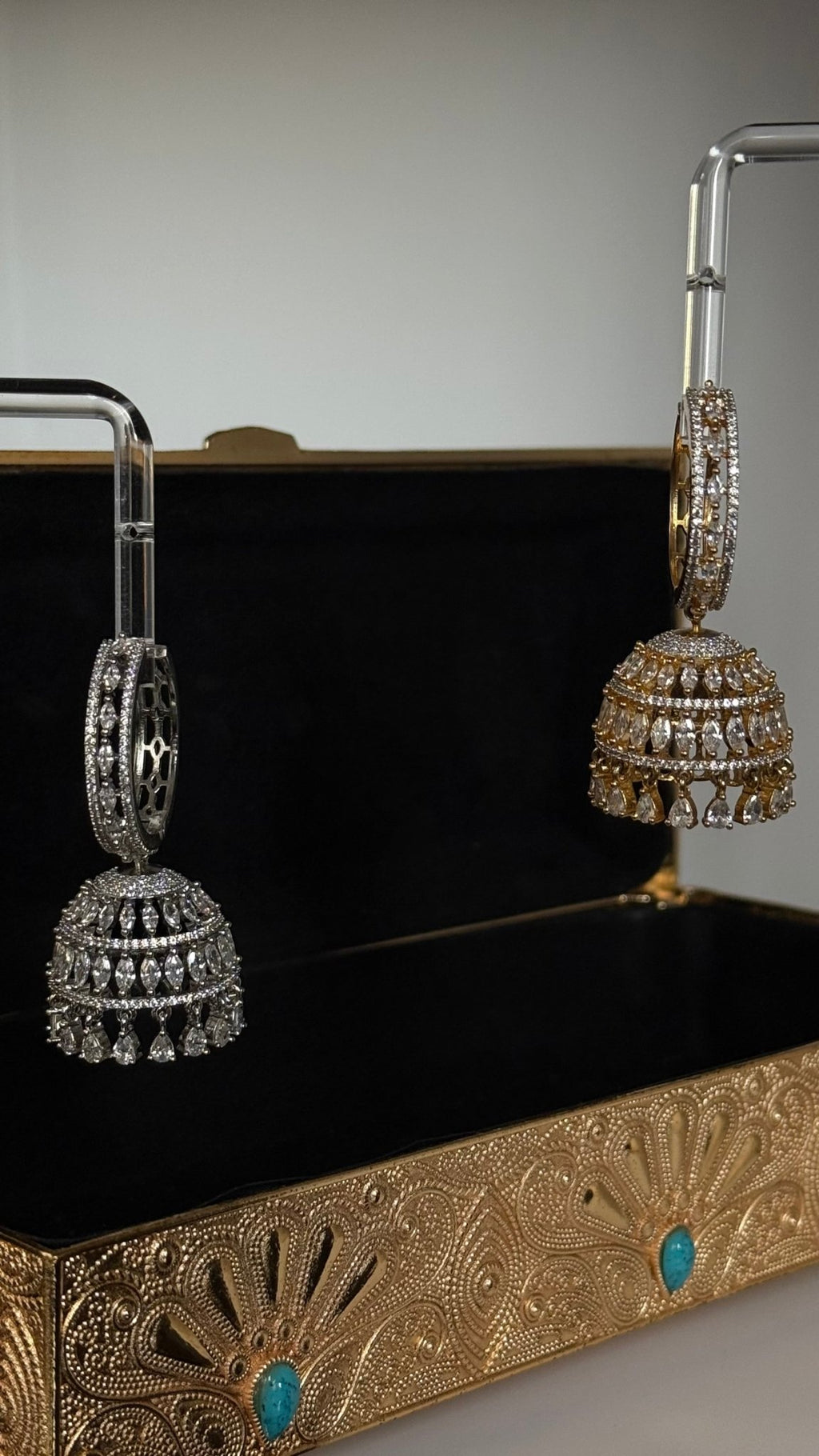 Gold-plated Sarima jhumka earrings with CZ stones
Silver rhodium Sarima jhumka earrings 
Sarima jhumka earrings styled