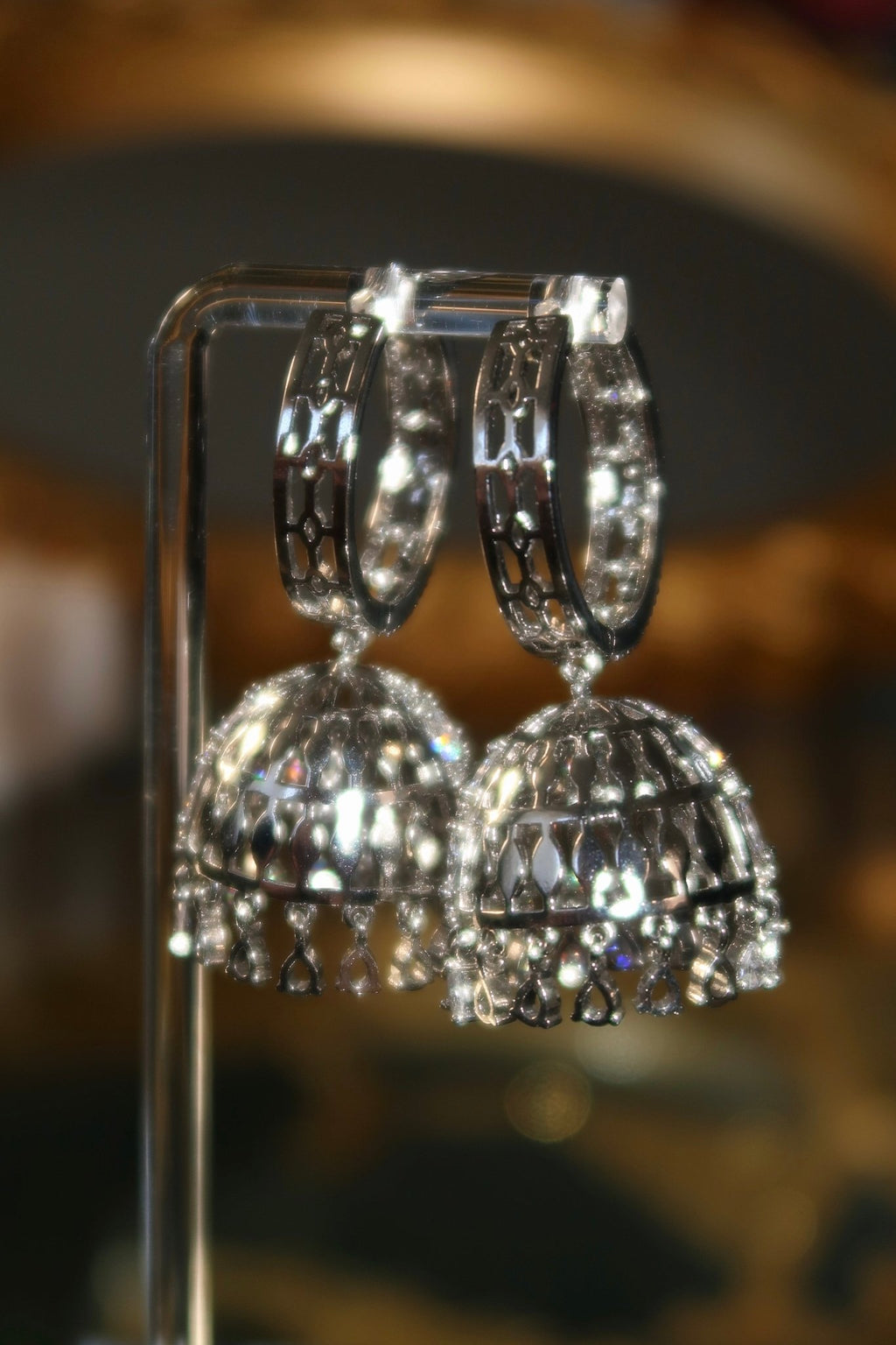 Gold-plated Sarima jhumka earrings with CZ stones
Silver rhodium Sarima jhumka earrings 
Sarima jhumka earrings styled
