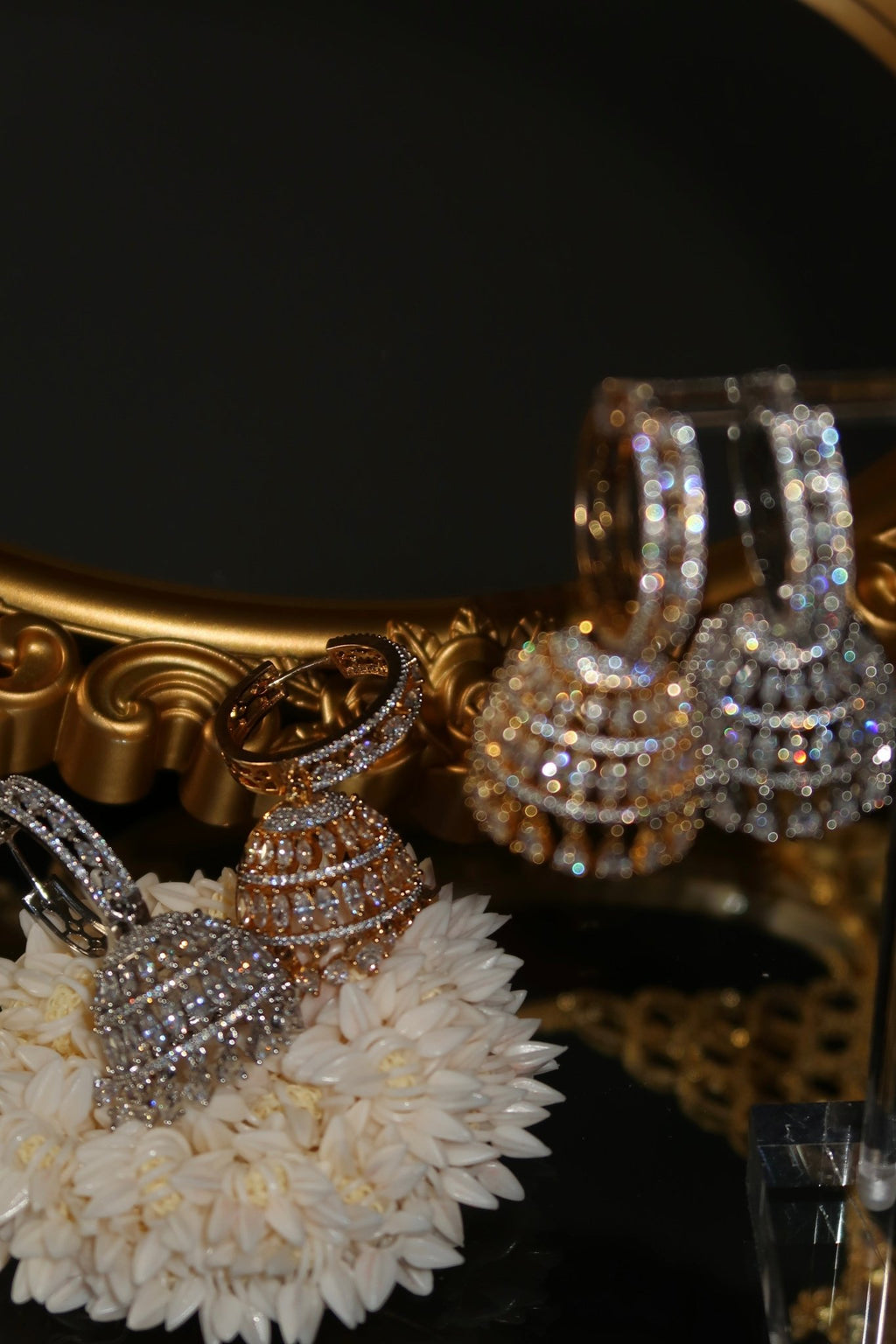 Gold-plated Sarima jhumka earrings with CZ stones
Silver rhodium Sarima jhumka earrings 
Sarima jhumka earrings styled