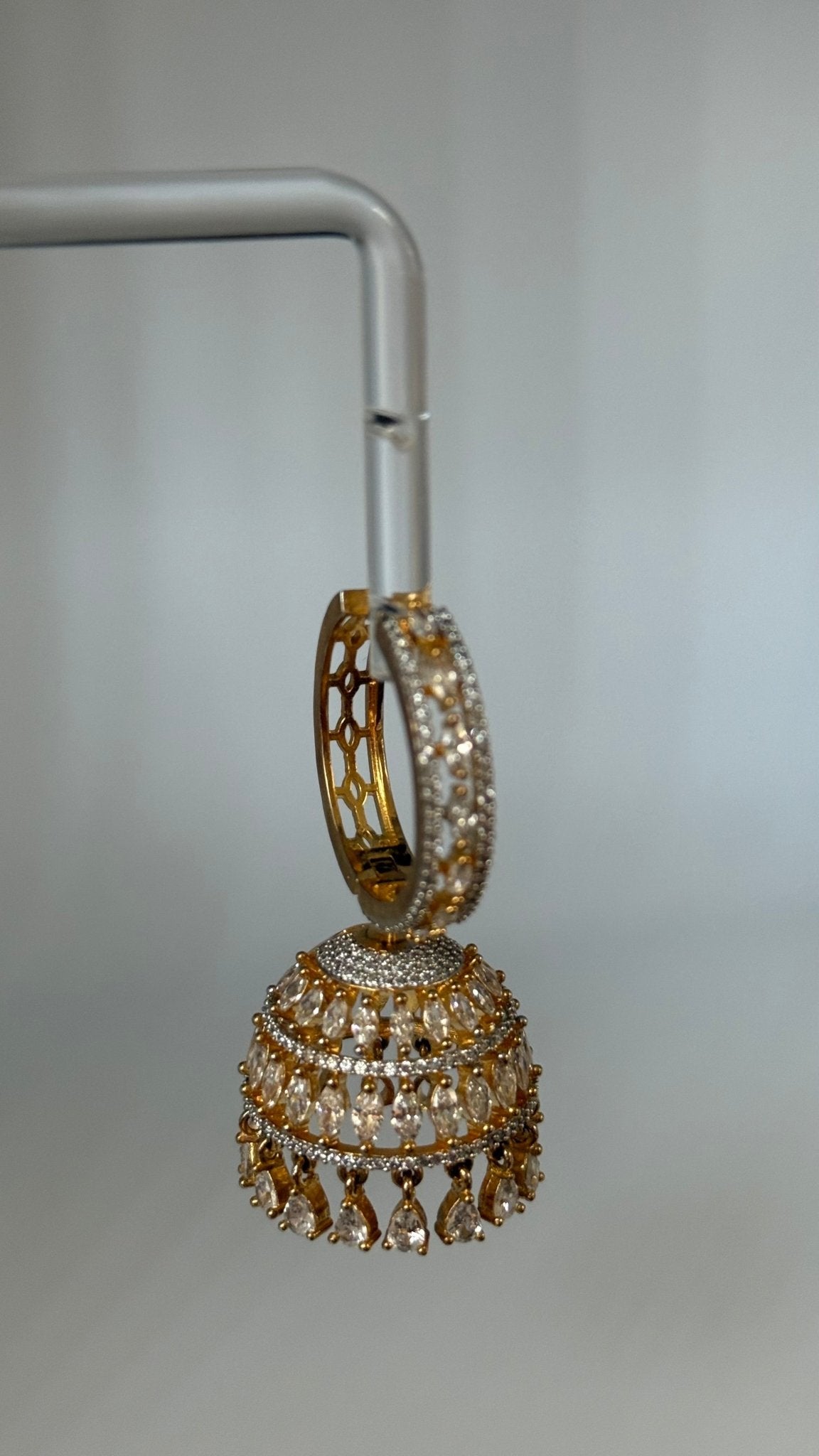 Gold-plated Sarima jhumka earrings with CZ stones
silver rhodium Sarima jhumka earrings 
jhumka earrings styled with outfit"