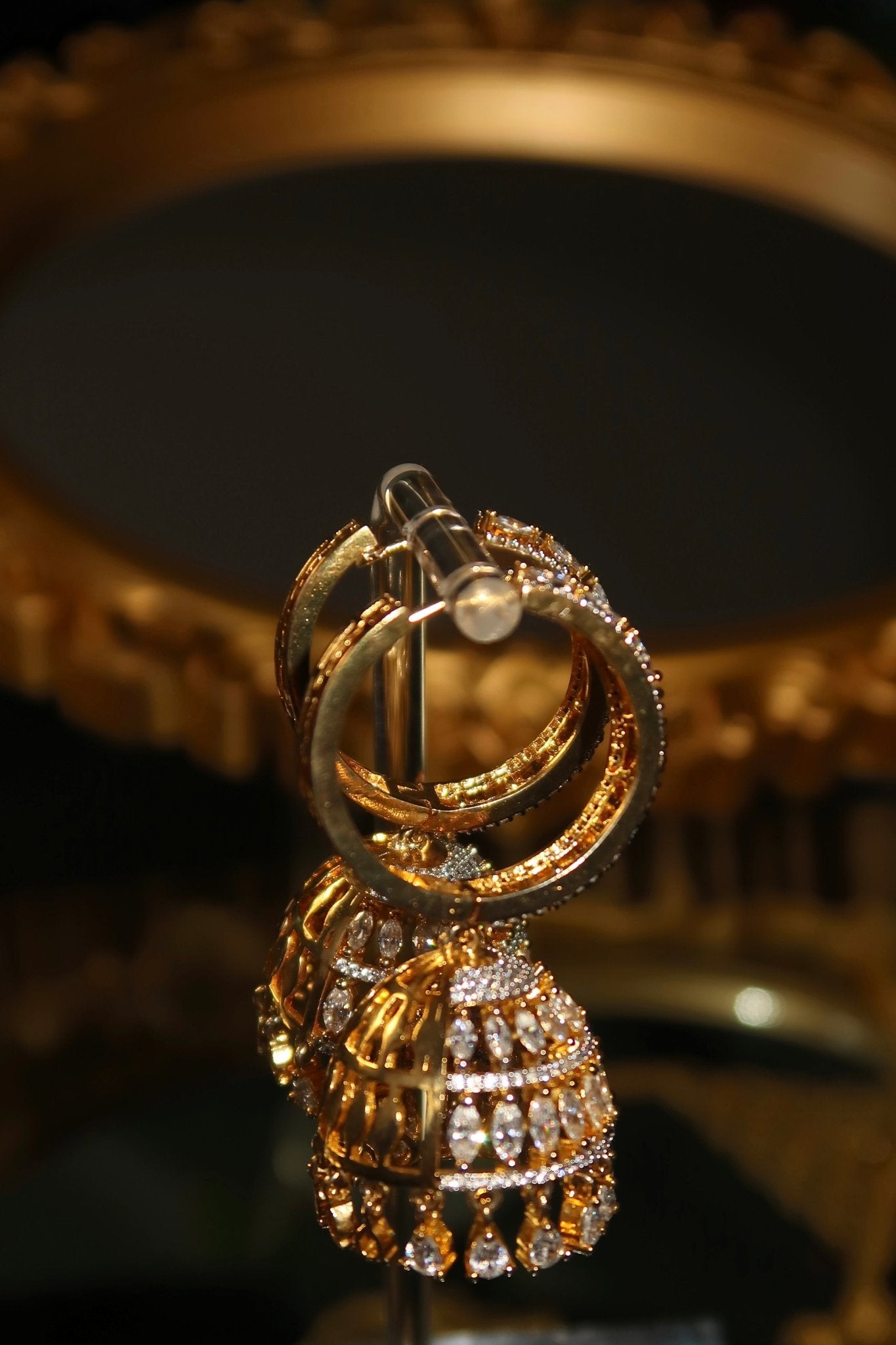 Gold-plated Sarima jhumka earrings with CZ stones
silver rhodium Sarima jhumka earrings 
jhumka earrings styled with outfit"