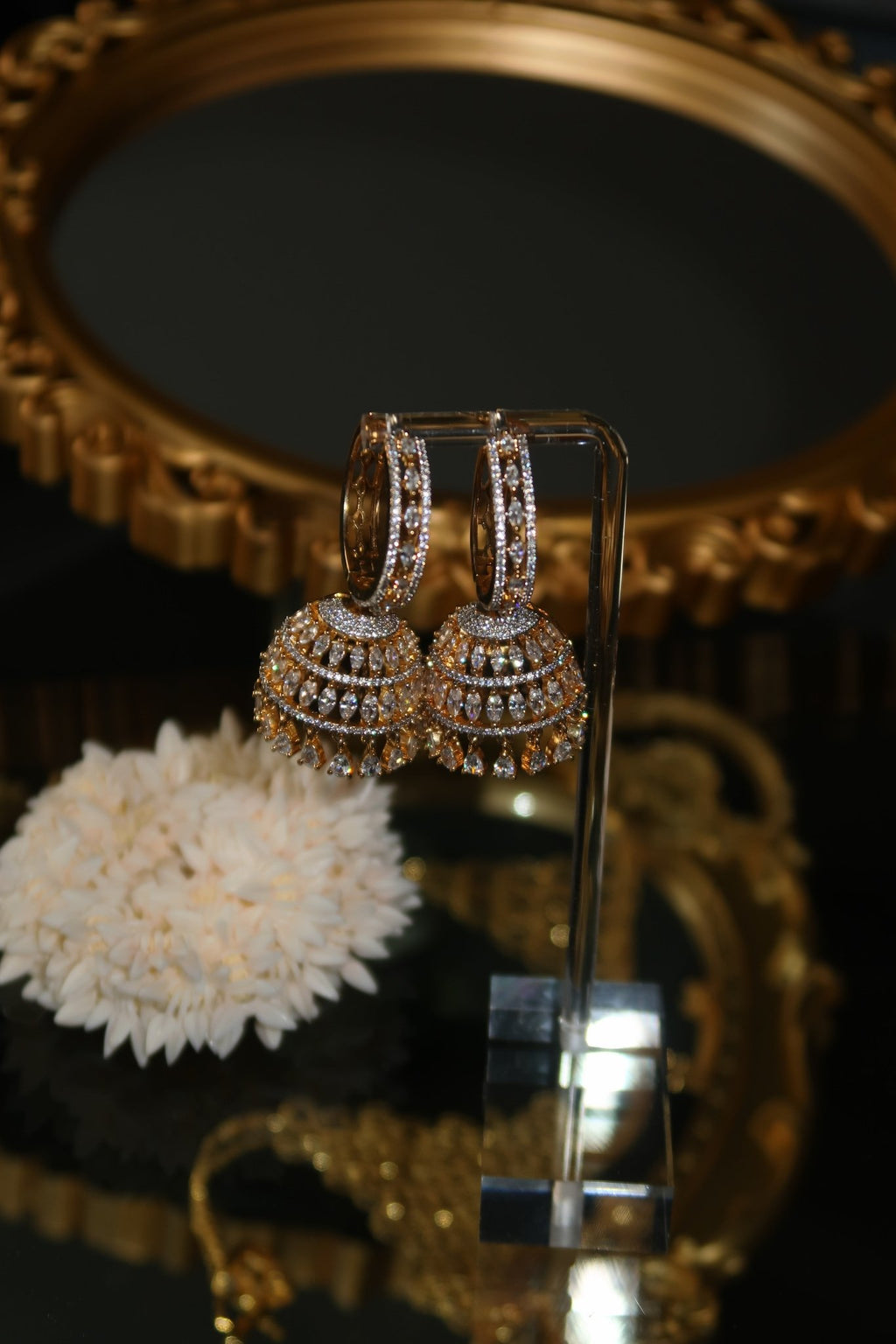 Gold-plated Sarima jhumka earrings with CZ stones
silver rhodium Sarima jhumka earrings 
jhumka earrings styled with outfit"